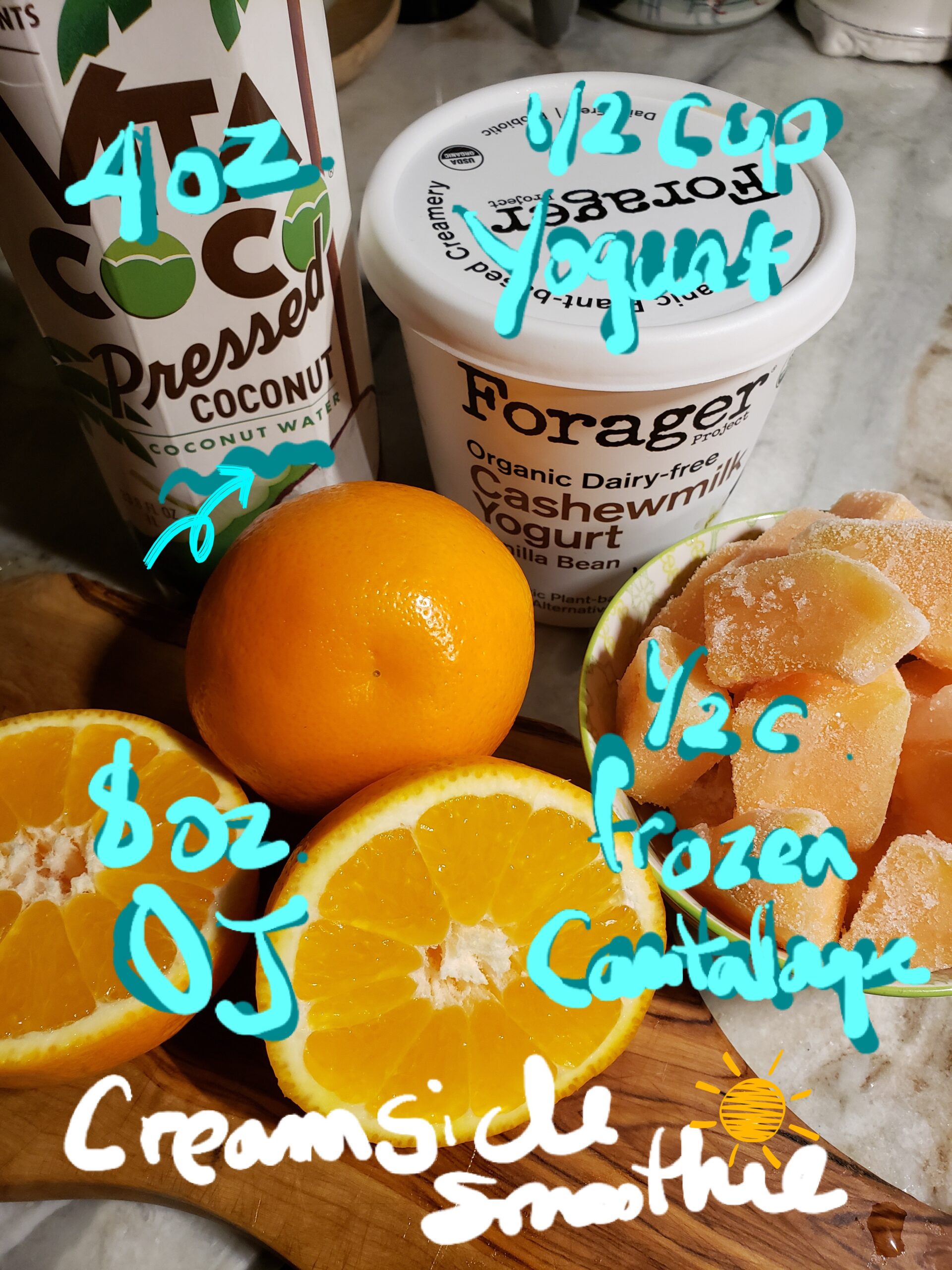 Ingredients for a refreshing orange smoothie with yogurt and coconut water.